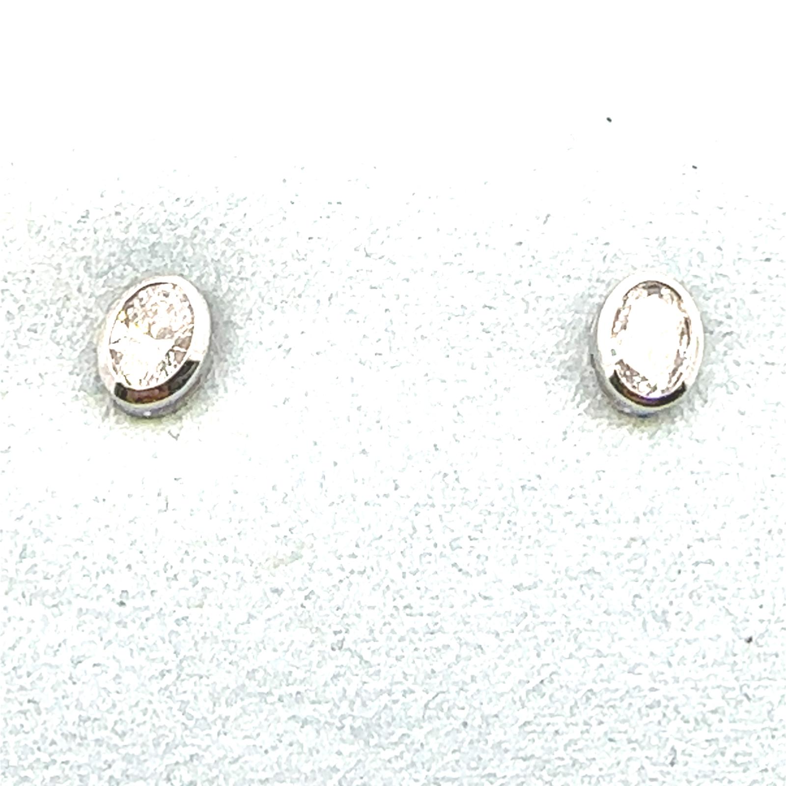 LUCY Earrings  0.40   with 0.40  Oval Lab Grown Diamond Sides set on 0.79gr 10k WG