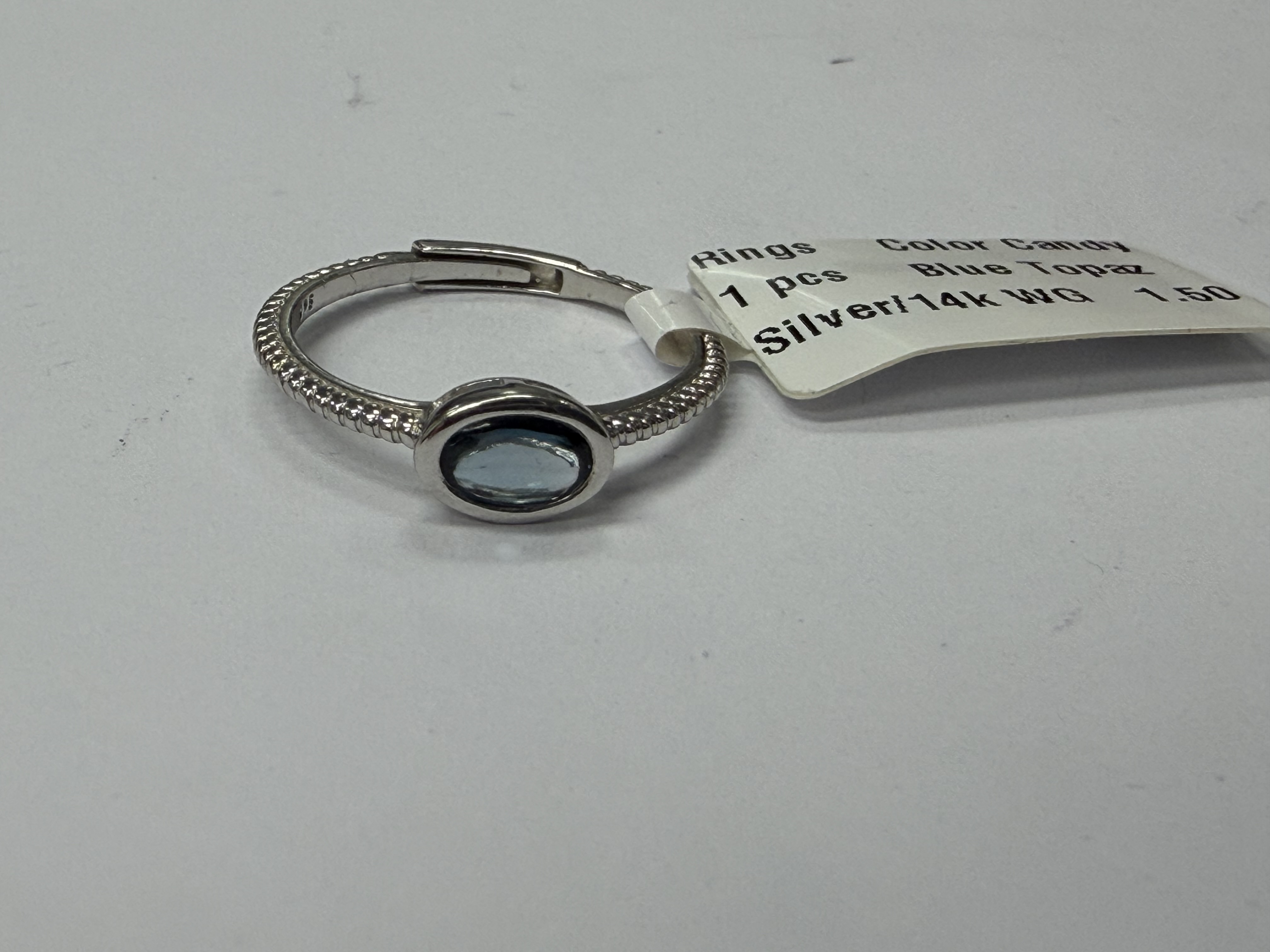 Color Candy Collection Rings with 1 pcs 6X4 OV Blue Topaz set on 1.5 gr SS/14k WG 